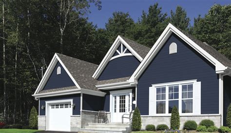 dark blue house with white shutters